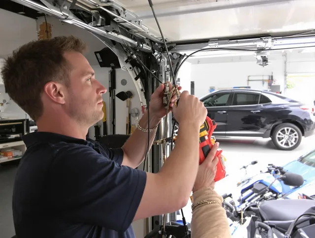 East Haven Garage Door Repair safety certified technician performing cable replacement in East Haven