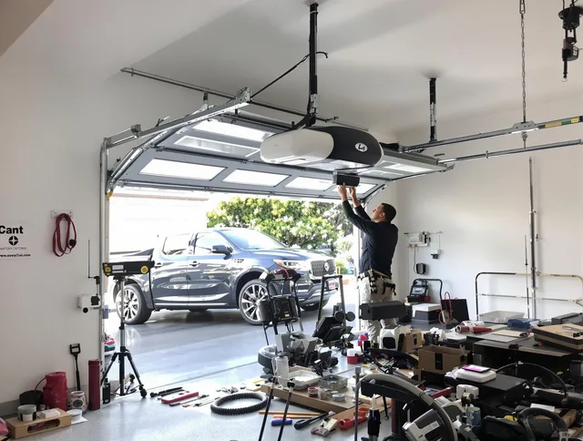 East Haven Garage Door Repair specialist installing smart garage door opener system in East Haven home