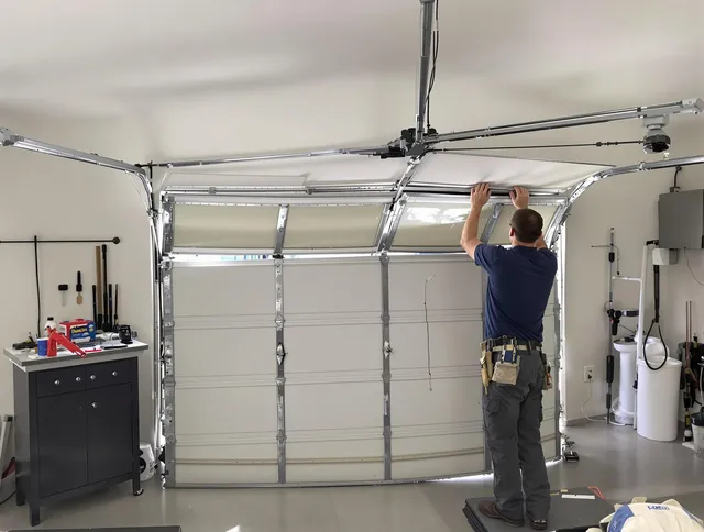 East Haven Garage Door Repair specialist performing precise section replacement on East Haven garage door